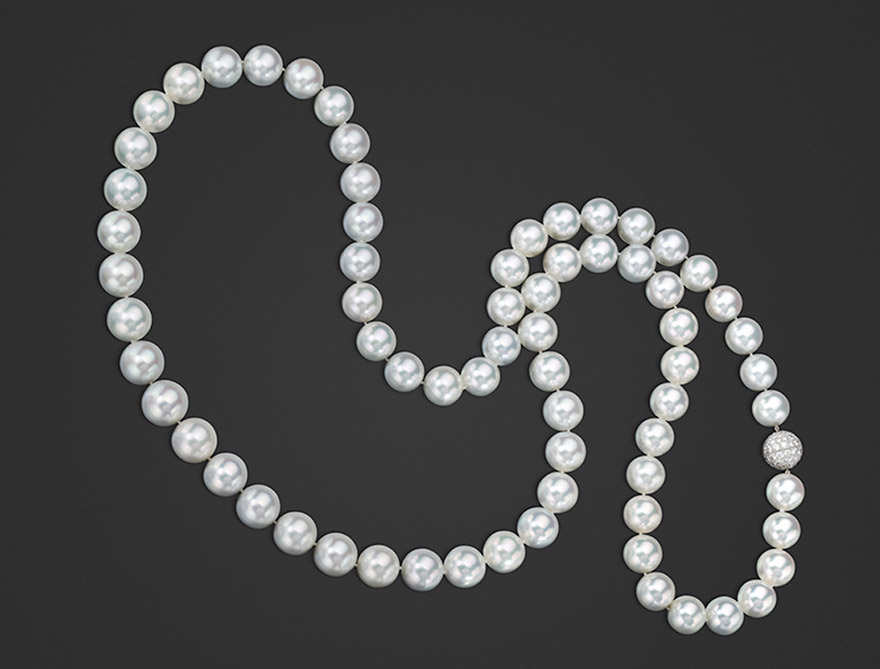 Classic South Sea Pearl Opera Length Necklace A rare rope of Gem South Sea Pearls: round white pearls with incredible luster, lovely pink overtones, and a luxurious feel. With pavé diamond clasp.
