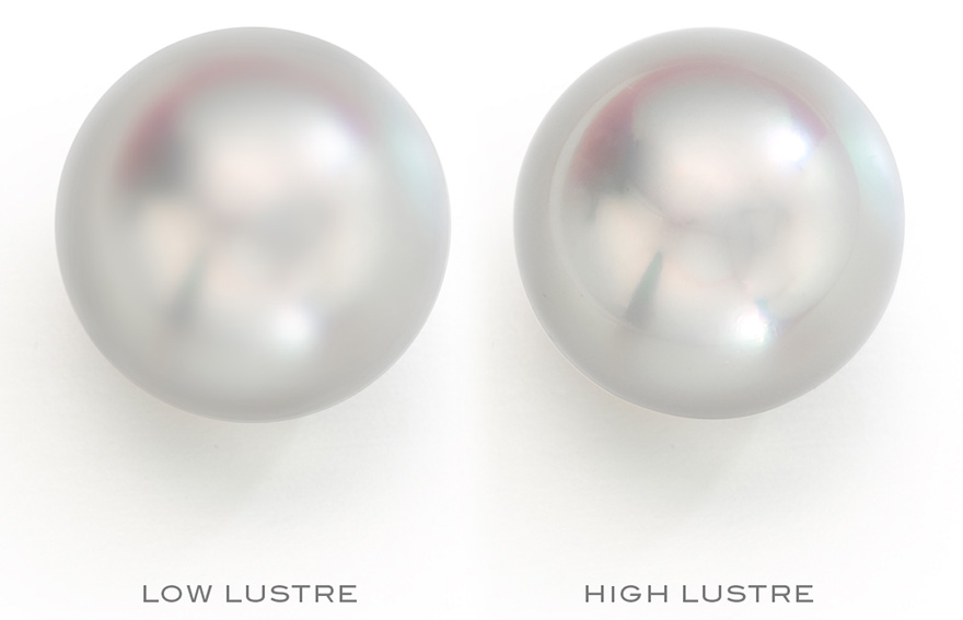 Two pearls demonstrating the difference between low and high lustre