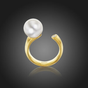 11.0mm South Sea Cultured Pearl and a half-carat Diamond set on an angle across an open band of 18K Yellow Gold