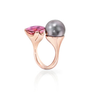 Cushion-Cut Bi-Color Tourmaline of nearly 28 carats is surrounded by 19 Baby Akoya Natural Color Cultured Pearls, 3.5 - 4.0mm. Rose Gold.