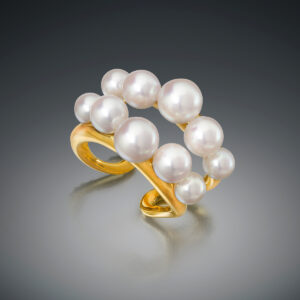 Ten lustrous Akoya Cultured Pearls double gold band by Sean Gilson for Assael.