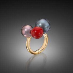 Ring Featuring 2 Tahitian Natural Color Cultured Pearls, approximately one in Aubergine and one in Grey, and a single Sardinian Coral Bead, 14.0mm. In 18K Yellow Gold. Responsibly sourced.