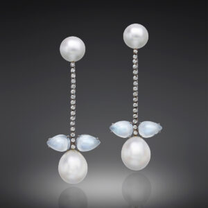 2 Round South Sea Cultured Pearls, 2 Drop South Sea Cultured Pearls, 4 Moonstones, and 2 carats of sparkling Diamonds set in a soft, fluid line that moves with the wearer.