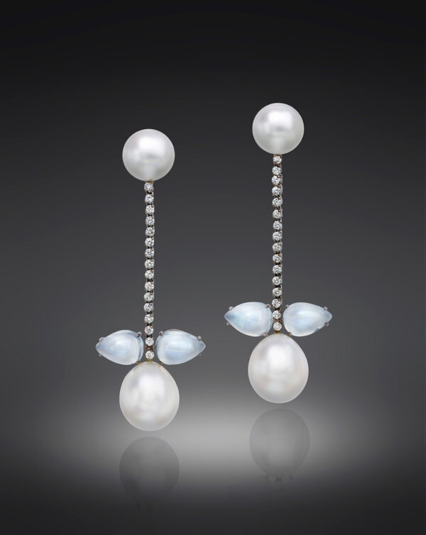 2 Round South Sea Cultured Pearls, 2 Drop South Sea Cultured Pearls, 4 Moonstones, and 2 carats of sparkling Diamonds set in a soft, fluid line that moves with the wearer.